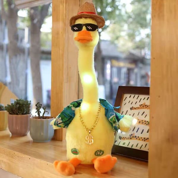 DuDuck vesela plesna patka, plišanac za djecu koji pleše. Patka nosi košulju kratkih rukava, slamnati šešir, sunčane naočale